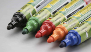 Closeup of five VBoard markers in vibrant colors: black, blue, green, red, and orange